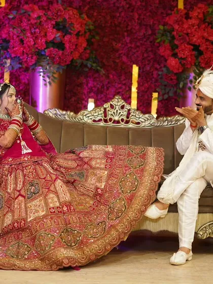 Wedding photography should also be fun. I love encouraging couples to relax and be themselves, which leads to playful and memorable shots like this one during their stage reception.