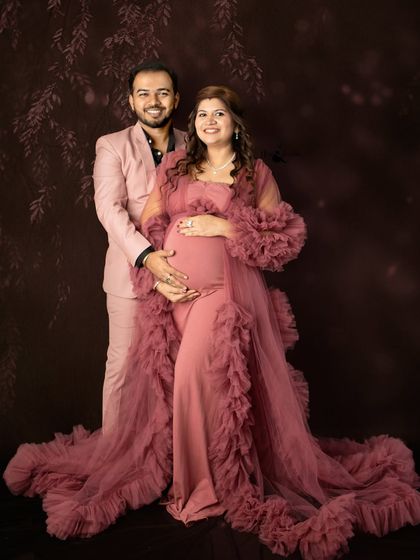 A beautiful, formal portrait of the couple. The flowing gown and the smart suit create a timeless look, perfect for celebrating this milestone.