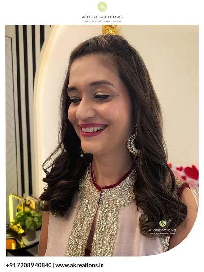 A happy client showing off her finished hair and makeup. The glowing skin and bright smile say it all.