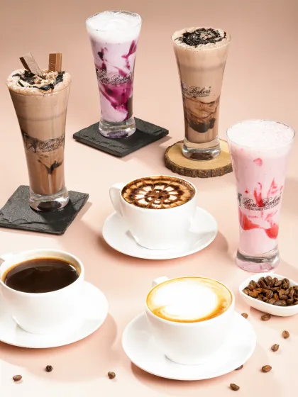 Showcasing a full range of beverages requires careful composition and lighting. This group shot for a bakery highlights the variety of their coffee and shake menu in a single, appealing image.