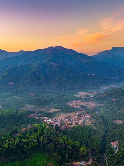 An aerial view of the town of Hornadu nestled in the Western Ghats at sunset. This was from a trip focused on serene immersion in nature, a contrast to my usual whirlwind road trips.