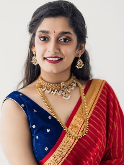 A simple, smiling portrait. It shows that even with bold makeup, a natural and happy expression can shine through.