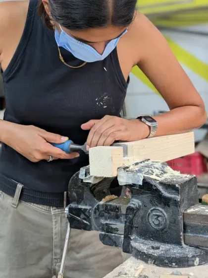 There's something special about using hand tools. It's a direct connection between you, the tool, and the wood. Here, a participant is carefully chiseling a joint, learning a skill that's been passed down for generations. It takes patience, but the result is so worth it.