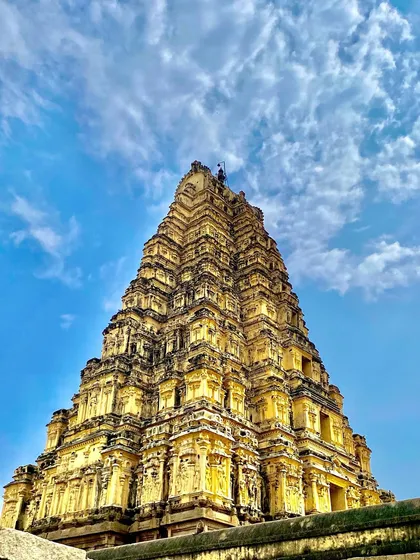 The towering gopuram of the Virupaksha Temple against a brilliant blue sky. This is one of India's oldest functioning temples, and its energy is something you have to experience firsthand.