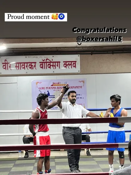 The moment of victory. The referee raises Sahil's hand after a hard-fought win at the Guru Purnima tournament. This feeling is what we chase every day in the gym.