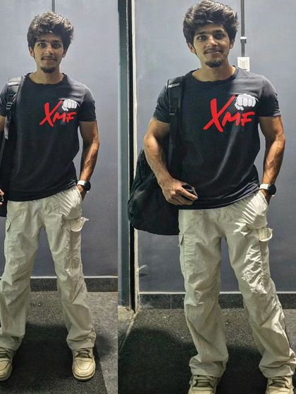 Sporting the new XMF T-shirt. Our brand represents strength, community, and the relentless pursuit of excellence in martial arts and fitness.