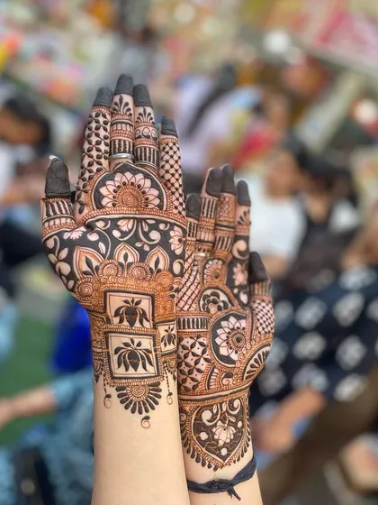 A close-up of the lotus-themed design, showing the intricate details on the palms.