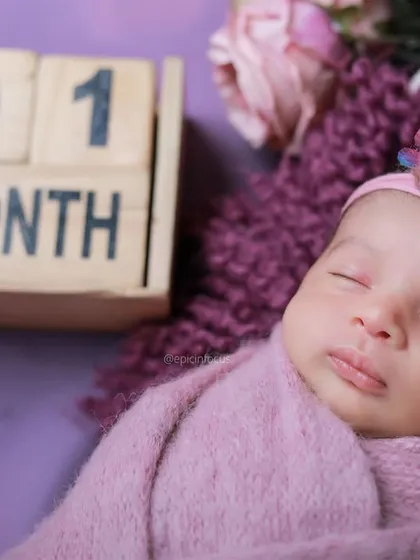 A detailed close up of a sleeping one-month-old, highlighting their delicate features. These macro shots are perfect for remembering just how tiny they were.
