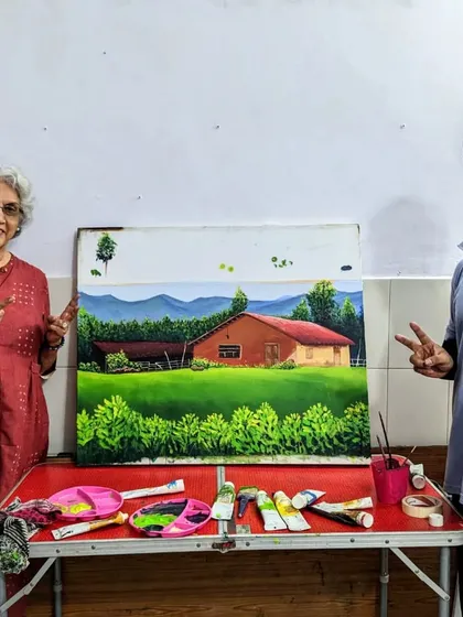A proud moment for both student and mentor. Harinder ma'am and our instructor pose with her beautifully finished landscape painting.