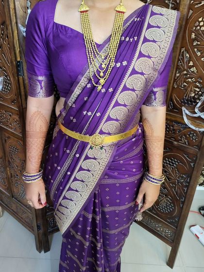 Another angle of the body-hugging drape, highlighting the slim fit and the way the saree accentuates the client's figure.
