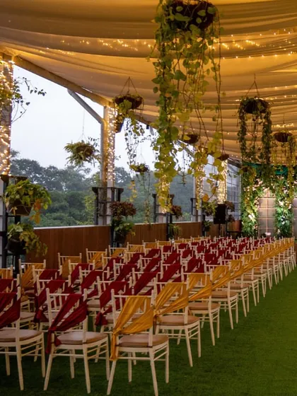 Another perspective of the Sky Terrace seating arrangement, showcasing the artificial grass flooring and elegant chair ties that can be customized to your wedding theme.