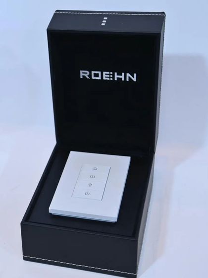 A pristine white Roehn keypad presented in its elegant black packaging, reflecting the premium quality of the product.