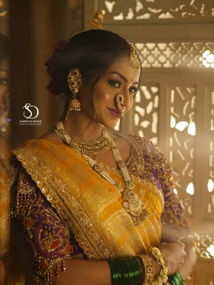 A candid moment with my beautiful Maharashtrian bride. The soft lighting and traditional window frame create a timeless portrait, showcasing her radiant smile and the complete bridal look.