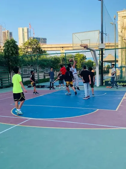 A player attempts a jump shot, showing the skills honed during our sessions.