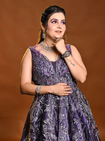 A beautiful purple gown for your engagement or party. The semi-cut crease makeup perfectly complements the outfit.
