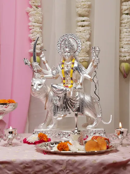Embrace the protective and powerful energy of Goddess Durga with this majestic silver-plated idol. Every detail, from her determined expression to the weapons in her hands, is crafted to embody strength, courage, and divine grace.