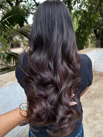 Her first hair color, and we went with a beautiful 'Cocoa Bean' shade. This is a great choice for a first-timer, as it's a subtle, rich brown that enhances natural hair color without being too dramatic.