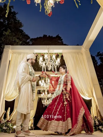 A moment of pure romance under the stars. This couple shares a dance within their beautifully lit mandap, showcasing how our designs create intimate spaces for unforgettable memories.
