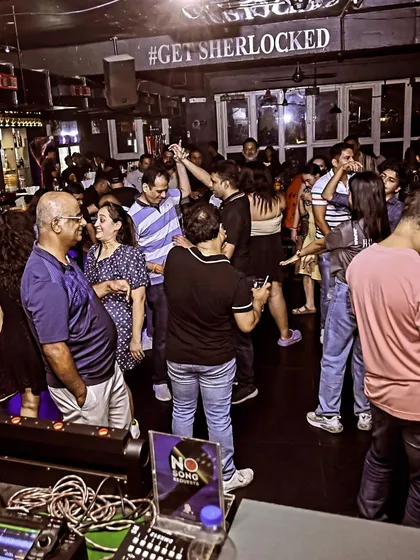 A wider view of the dance floor at Sherlock's. It's great to see people of all ages enjoying the music and dancing together.