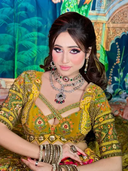 A stunning Mehendi look with a vibrant yellow and pink eye makeup. The colors are bold and playful, perfect for the occasion.
