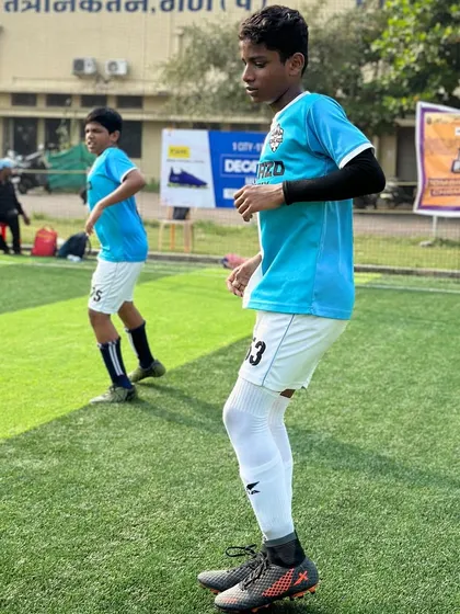 Another player preparing for the game, showing the focus and discipline we instill in our teams.