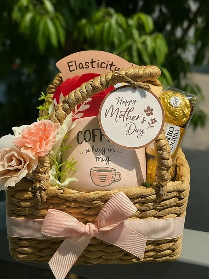 A simple and sweet Mother's Day gift. This basket includes a "Coffee, a hug in a mug," a face sheet mask, and Ferrero Rocher, wrapped in love and packed with joy.