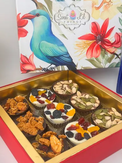 A closer look at our artisanal chocolate cups, perfect for gifting. This assortment features dark chocolate granola cups, white chocolate berry cups, and milk chocolate seed cups, each handcrafted to perfection.