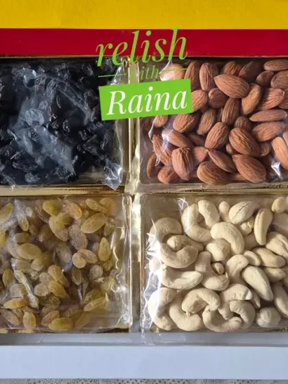 A custom dry fruit box for Diwali gifting. This one features four types of premium dry fruits: black raisins, almonds, golden raisins, and cashews, all packed fresh by me.