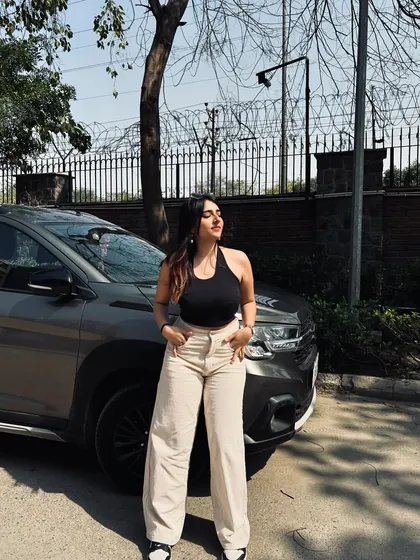 A classic combo of a black halter top and beige wide-leg pants. This is a timeless and versatile look that I love to style.