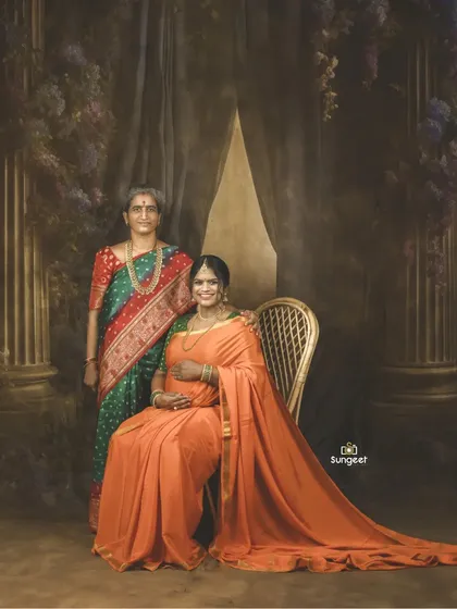 A multi-generational portrait, celebrating the journey of motherhood with both the expecting mother and her own mother. A truly precious memory.