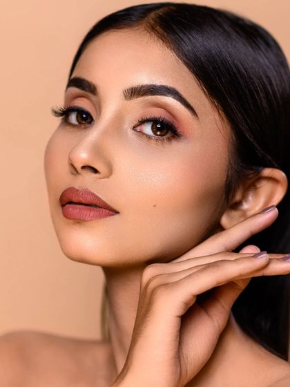 This beauty shot is a perfect example of my clean and polished retouching style. The skin looks flawless yet natural, and the makeup is beautifully defined.