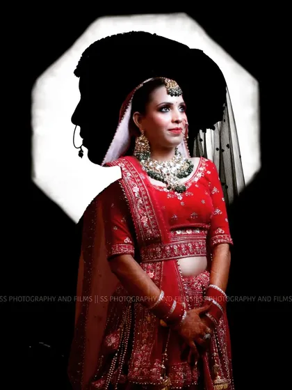 A creative double-exposure portrait combining the bride's image with the groom's silhouette. This is an example of our artistic approach to creating unique and personalized wedding photos.