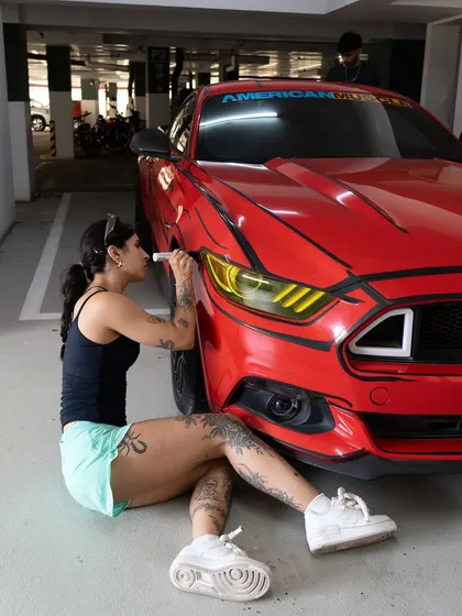Getting the details right on the headlights of the cartoon-style Mustang.