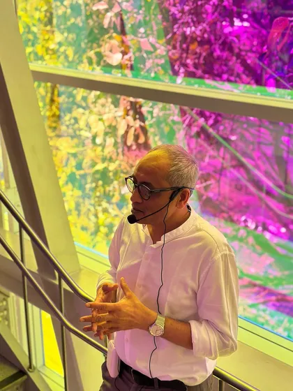 A photo of me, Soumitro Ghosh, speaking at the Museum of Art and Photography (MAP) in Bangalore. The vibrant, light-filled space provides a wonderful backdrop for discussing the role of light in architecture.