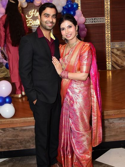 My client and her husband at their son's birthday celebration. She looks effortlessly elegant with a soft glam makeup look that's perfect for the occasion.