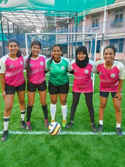 Girl Power! Our girls' team posing for a photo during a tournament, looking strong and united.