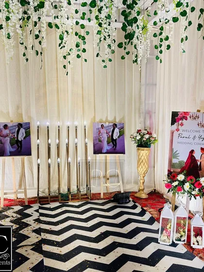 Another view of the personalized walkway, featuring the couple's photos, a custom welcome sign, and elegant lanterns, making the entrance a journey through their story.