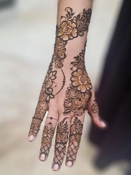 Another view of this floral design, showing how the pattern elegantly wraps around the side of the hand.