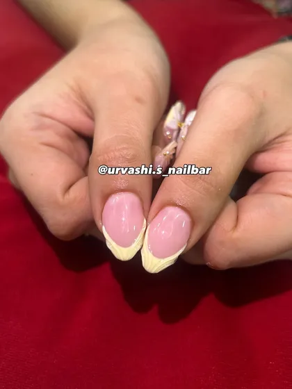 This elegant set features sculpted shell textures on the tips and hand-crafted 3D florals with tiny gold accents. The combination of textures on a soft blush base creates a truly sophisticated and artistic look.