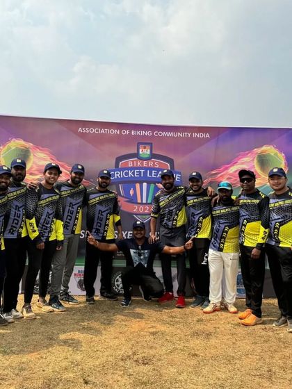 Our cricket team posing in front of the Bikers Cricket League banner. We play as a team, learn from our mistakes, and most importantly, enjoy the game.