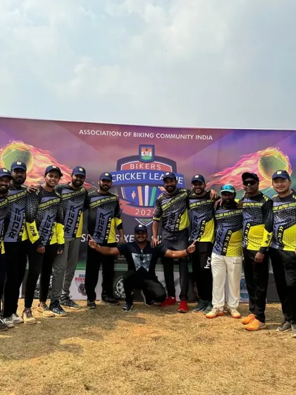Our cricket team posing in front of the Bikers Cricket League banner. We play as a team, learn from our mistakes, and most importantly, enjoy the game.