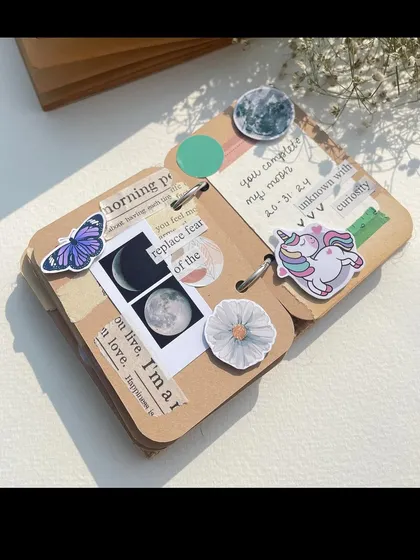 Another example of a micro-mini scrapbook page. This one uses cute stickers like a unicorn and a butterfly to create a dreamy, whimsical feel around the photos and notes.