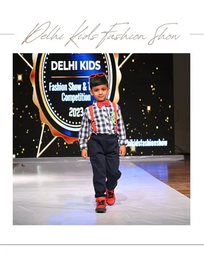 Dressed to impress. This little gentleman showcases his dapper style with a classic checkered shirt, bow tie, and suspenders. I love seeing the variety of outfits, from formal wear to trendy casuals, that kids bring to the runway.