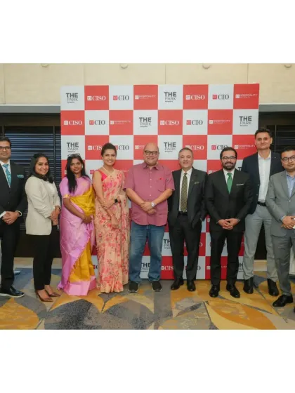 A group of industry leaders and our team pose in front of a branded backdrop for a hospitality forum. We are a chosen venue for key professional gatherings in the city.