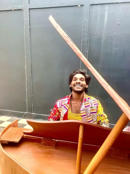 A happy moment on the set of the shoot, sitting in a boat prop. It's important to have fun while working.