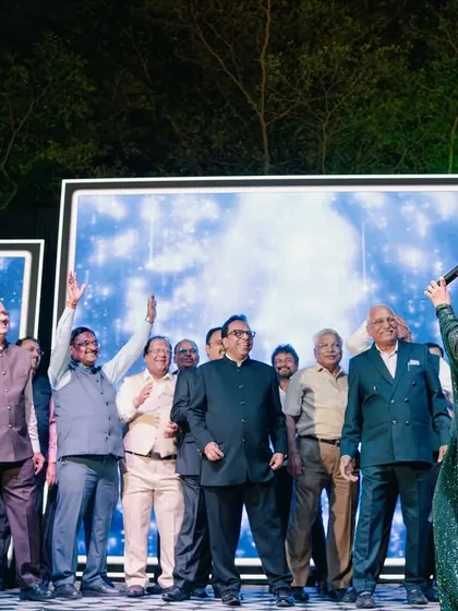 Leading a group of enthusiastic family members in a fun dance sequence. My job is to be the crowd's biggest cheerleader.