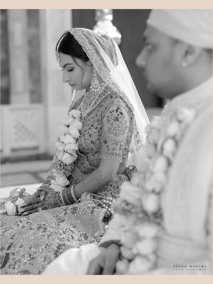 A moment of prayer and reflection during the ceremony. This black and white shot emphasizes the solemnity and spiritual significance of the rituals.