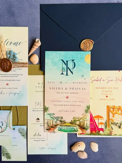 For Nistha and Prajval's destination wedding in Goa, we designed a complete stationery suite that captured the essence of a beach celebration. The set includes watercolor illustrated cards, a welcome note with a custom wax seal and seashell details, and matching gift tags.