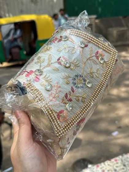 A close up of an embroidered clutch with sequins and rhinestones. The level of detail on these bags is amazing.