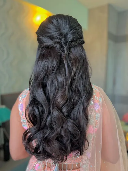 A classic half-updo with a fishtail braid detail.